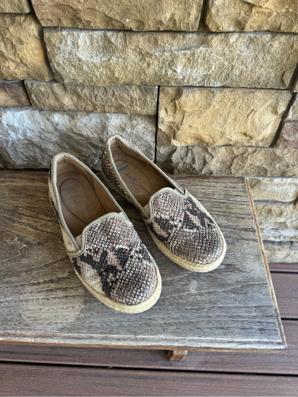 Woman’s size 8 Clarks slip on snake skin look